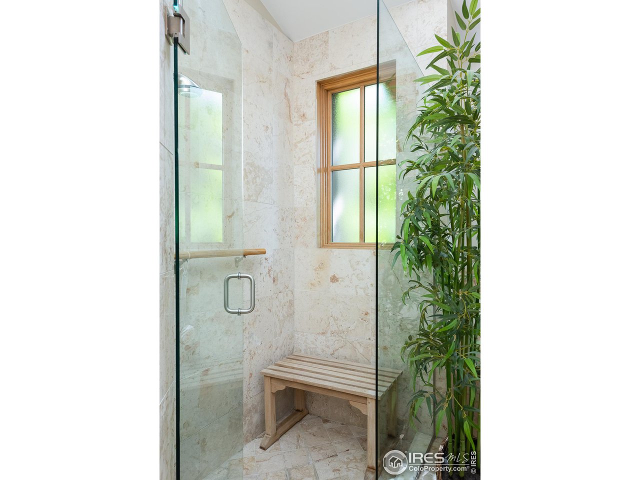 520 Spruce Street Boulder, CO 80302 - Photo 19 of 40 a bathroom with a glass shower door