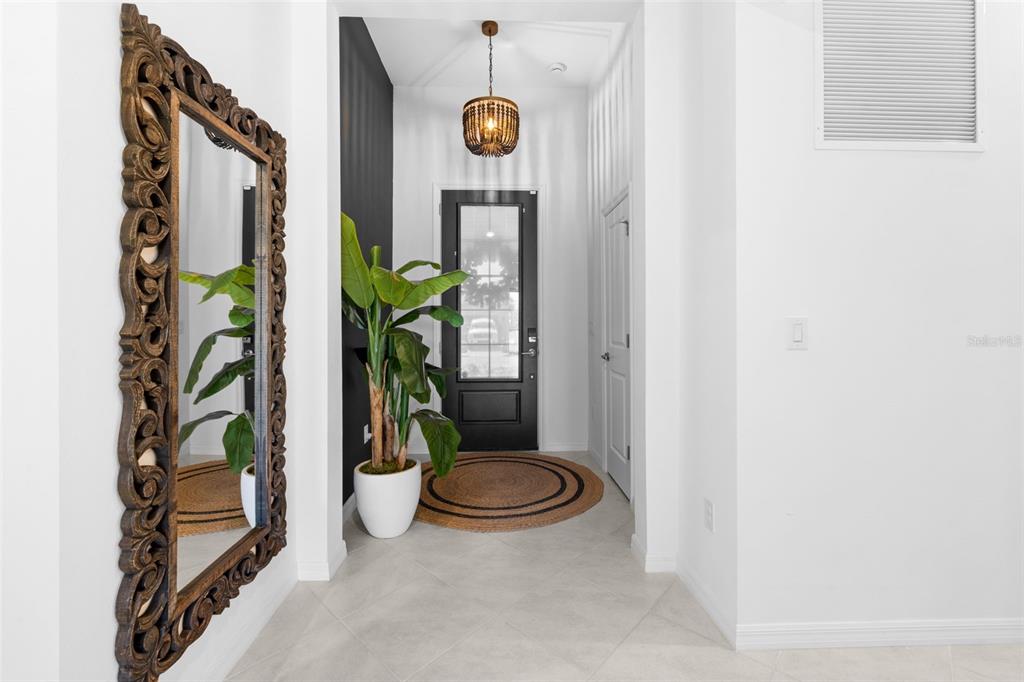 1842 West Isles Road Port Charlotte, FL 33953 - Photo 4 of 65 a view of potted plant in front of a door