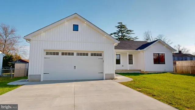 a view of house with yard