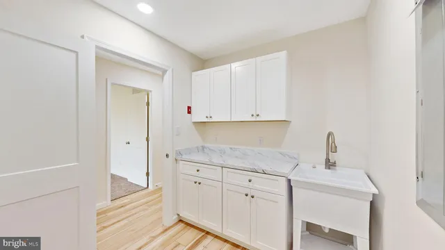 a kitchen with a sink and cabinets