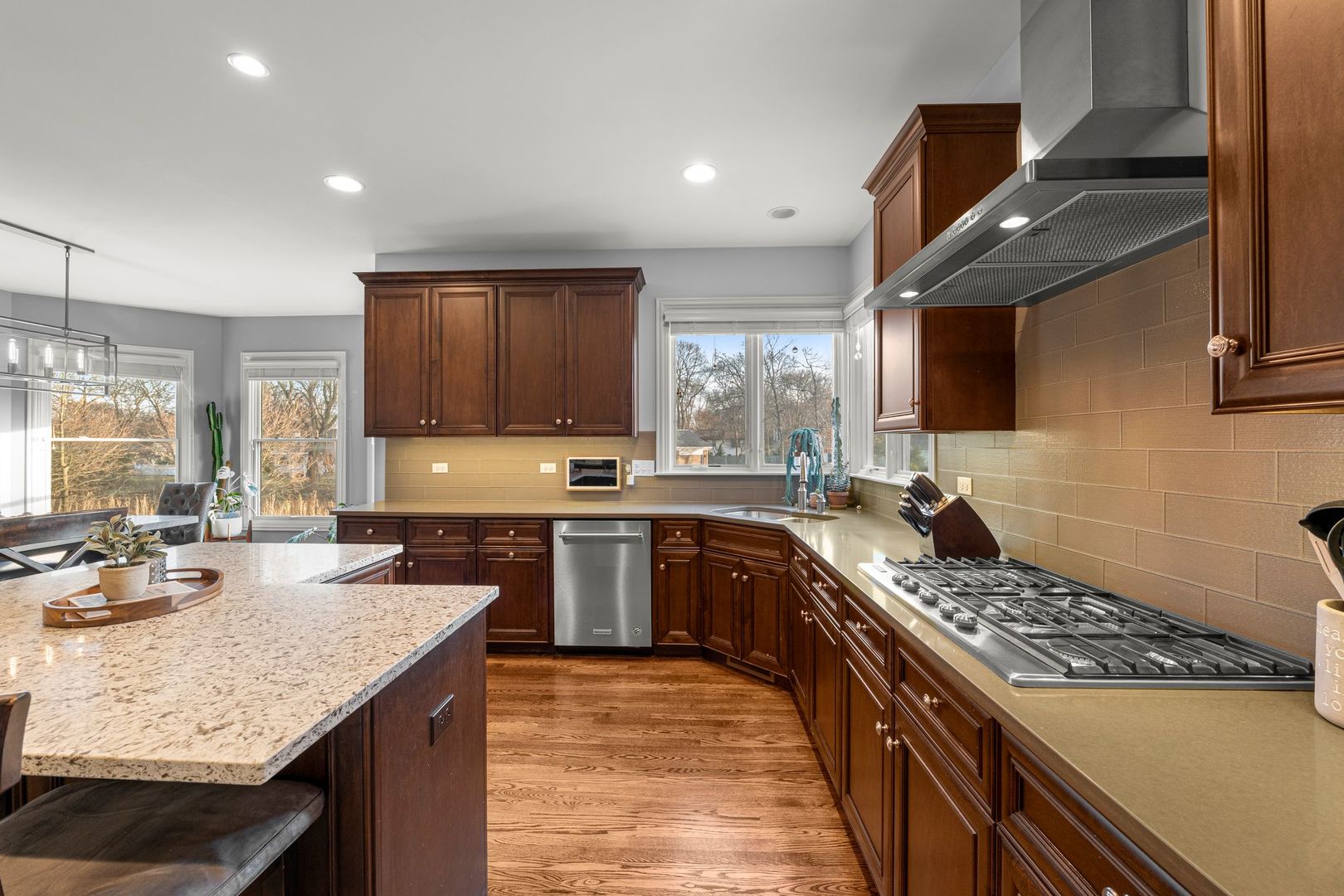 81 Landon Circle Wheaton, IL 60189 - Photo 22 of 79 a kitchen with a stove a sink a refrigerator and cabinets