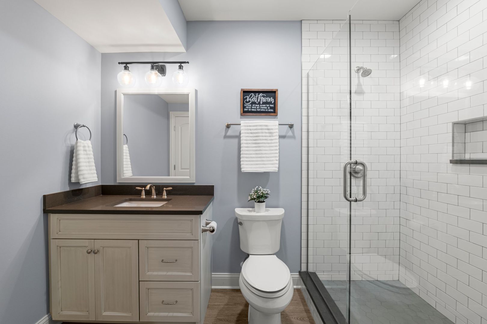 81 Landon Circle Wheaton, IL 60189 - Photo 61 of 79 a bathroom with a granite countertop sink toilet mirror and shower