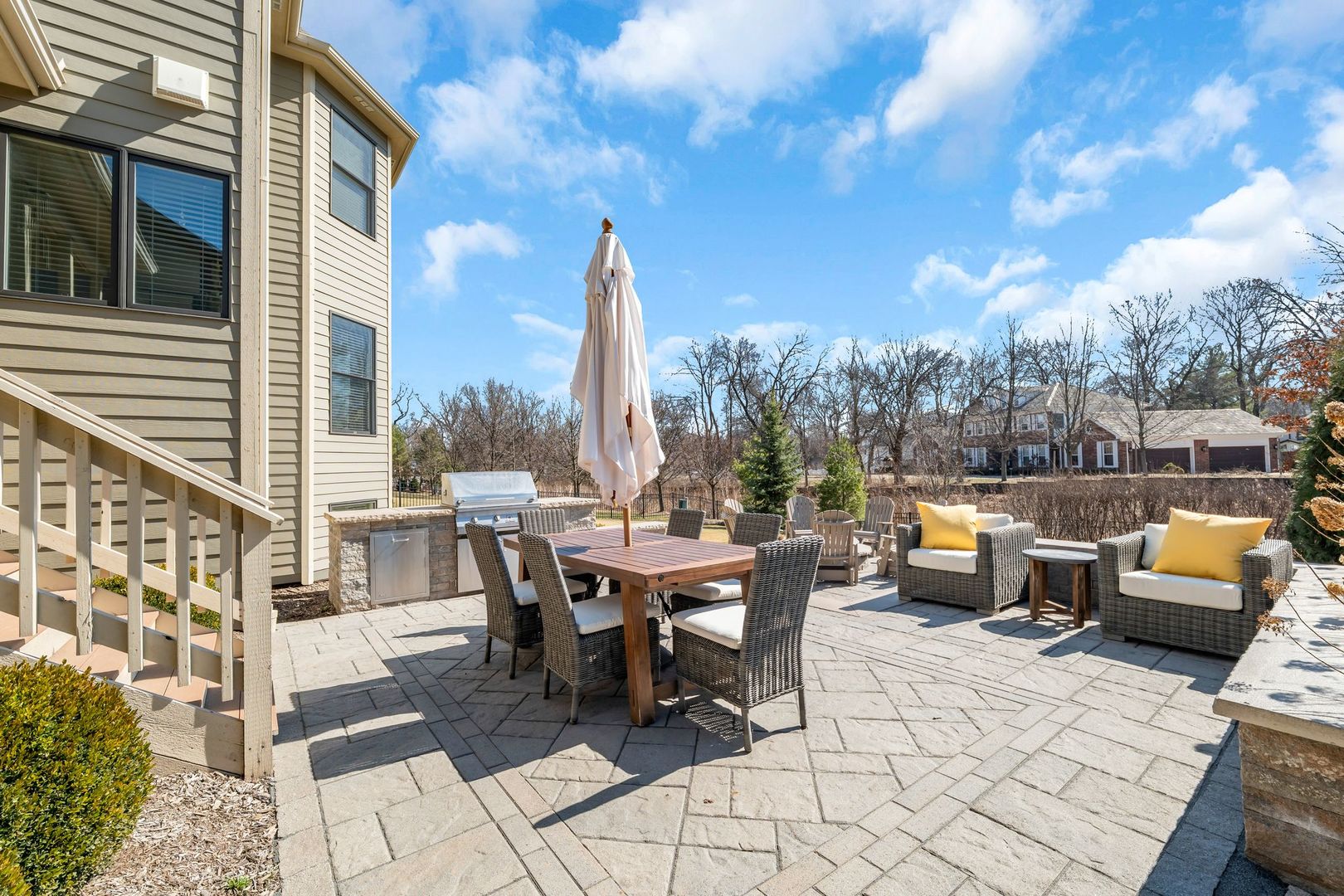 81 Landon Circle Wheaton, IL 60189 - Photo 63 of 79 a view of a patio with couches and table and chairs and potted plants