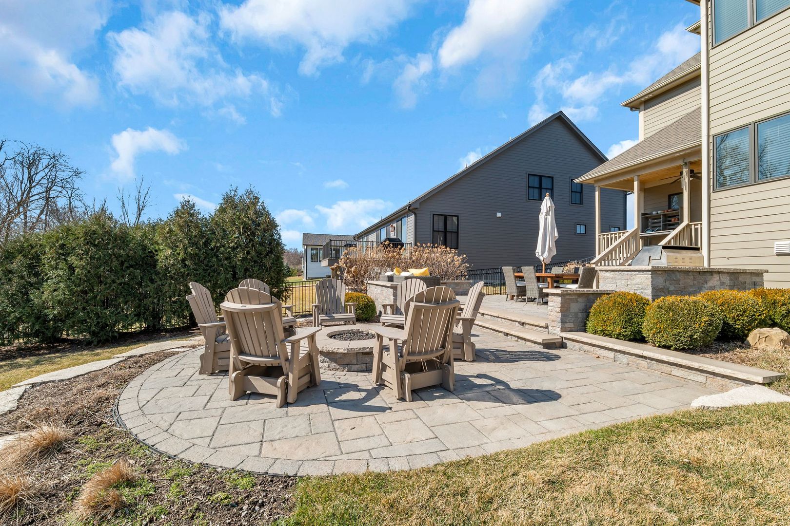 81 Landon Circle Wheaton, IL 60189 - Photo 68 of 79 a view of a patio with table and chairs with wooden floor and fence