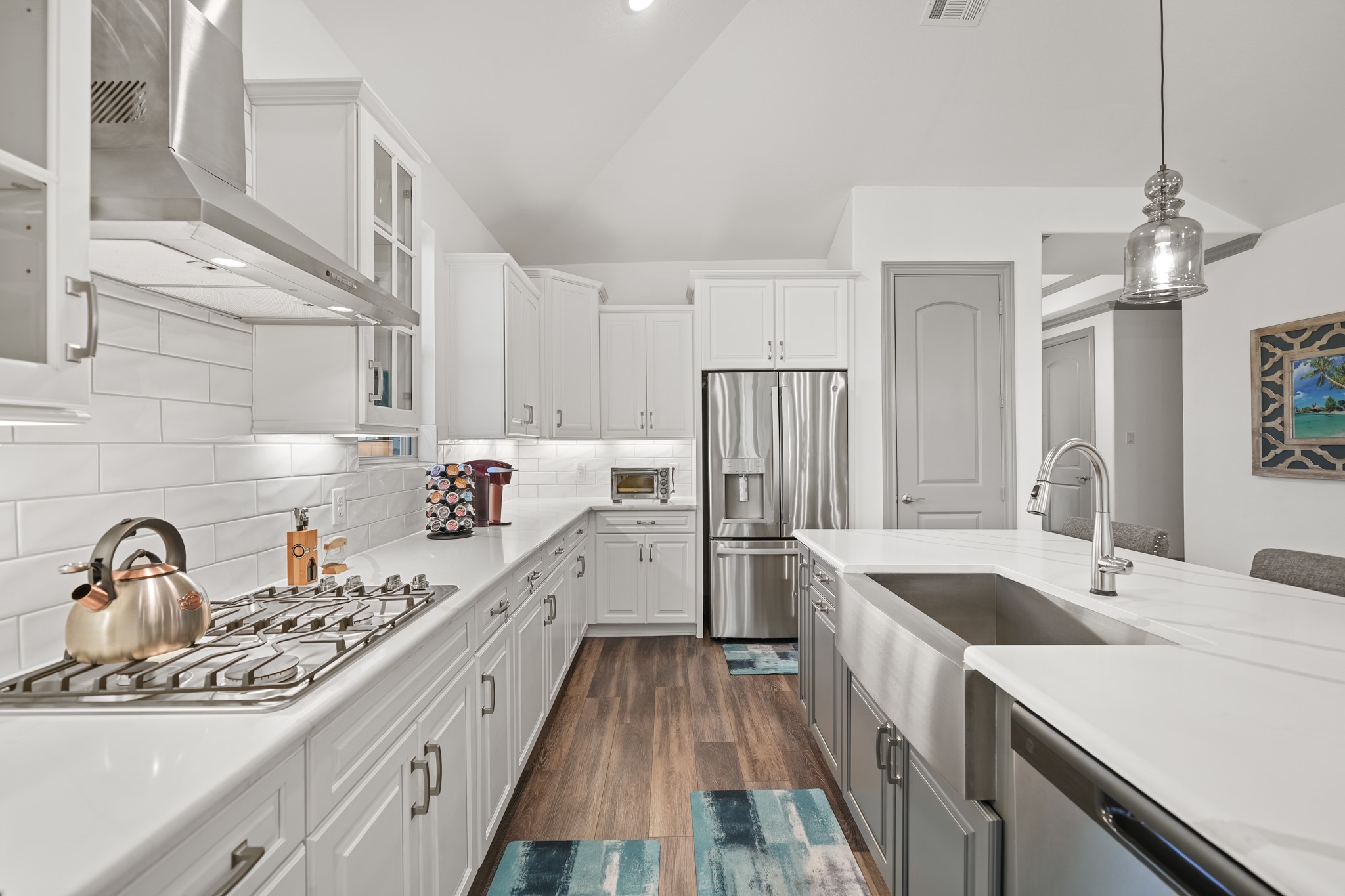 5739 Bobwhite Trail Manvel, TX 77578 - Photo 8 of 29 Abundant cabinetry, stainless steel appliances, and extensive counter space make this kitchen as functional as it is beautiful. A farmhouse sink adds both charm and practicality.