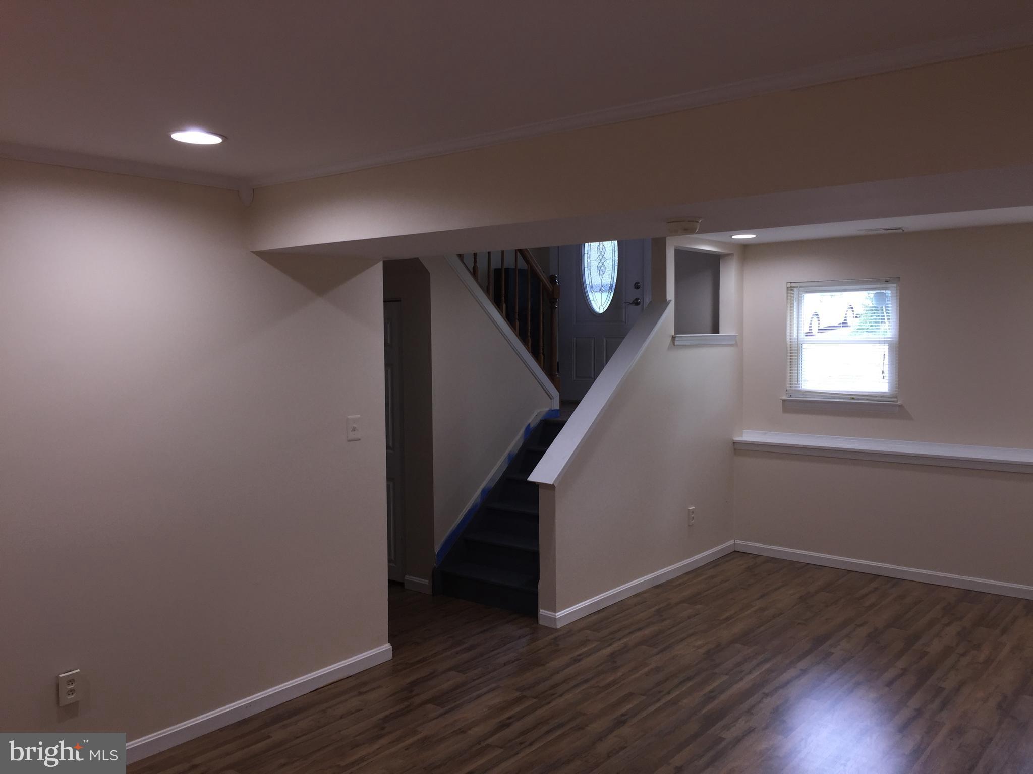 1329 Willow Spring Road Baltimore, MD 21228 - Photo 13 of 24 a view of entryway with wooden floor