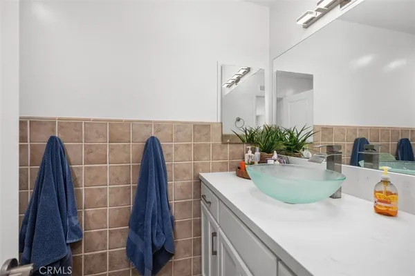 a kitchen with a sink and a potted plant