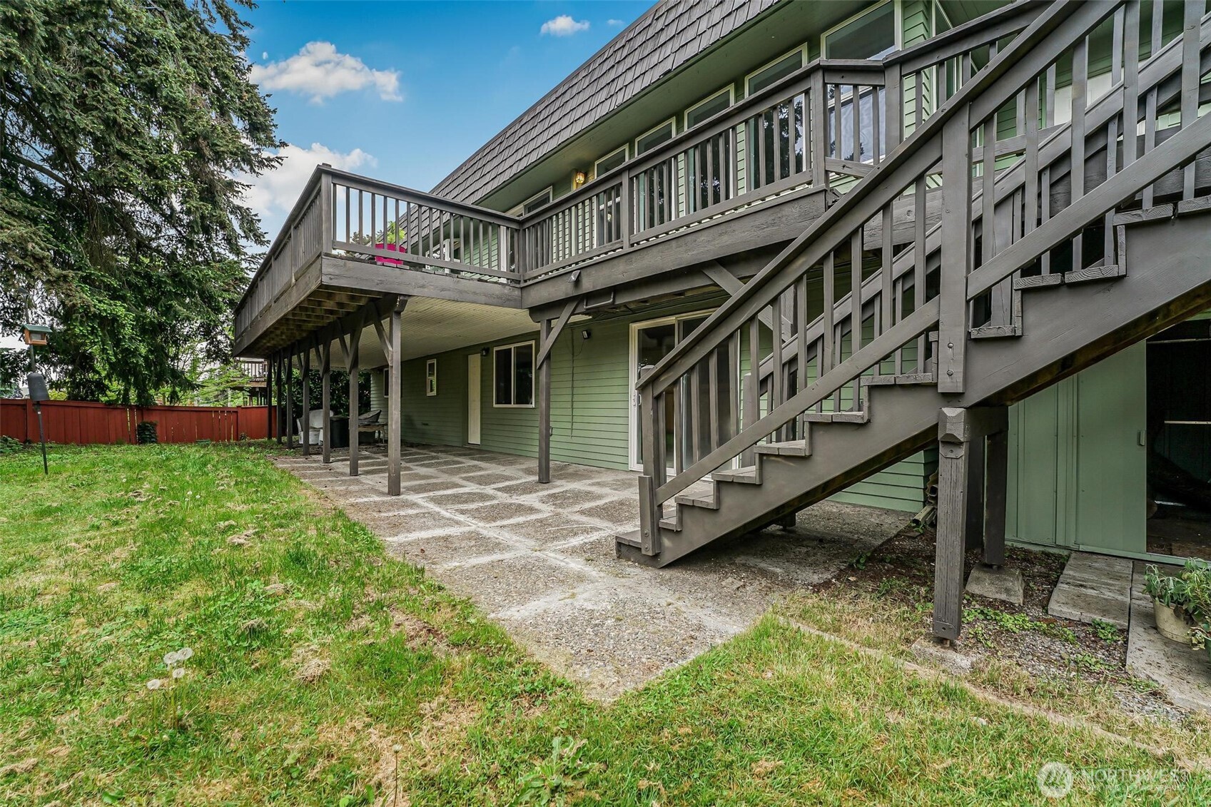 11404 Karshner Road East Edgewood, WA 98372 - Photo 36 of 40 a view of an house with backyard and deck