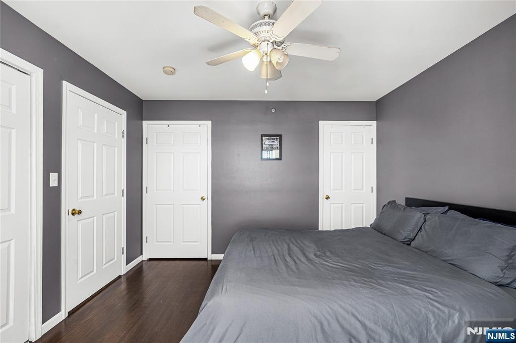 84 Union Street Newark, NJ 07105 - Photo 34 of 39 a bedroom with a bed and a ceiling fan