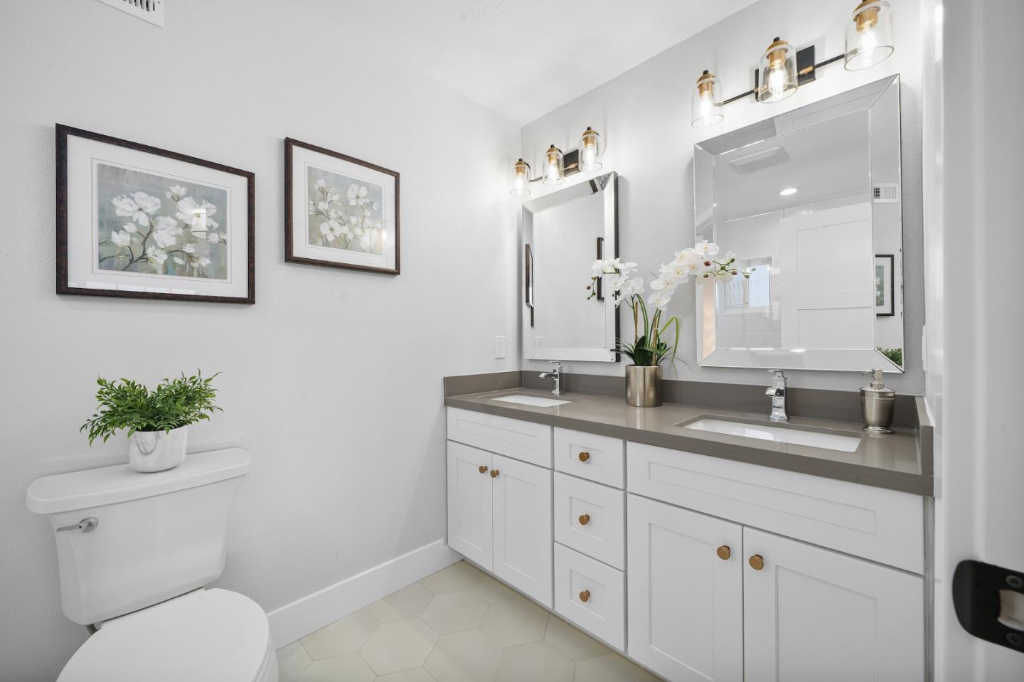 827 Bend Avenue San Jose, CA 95136 - Photo 17 of 27 a bathroom with a toilet a sink and mirror