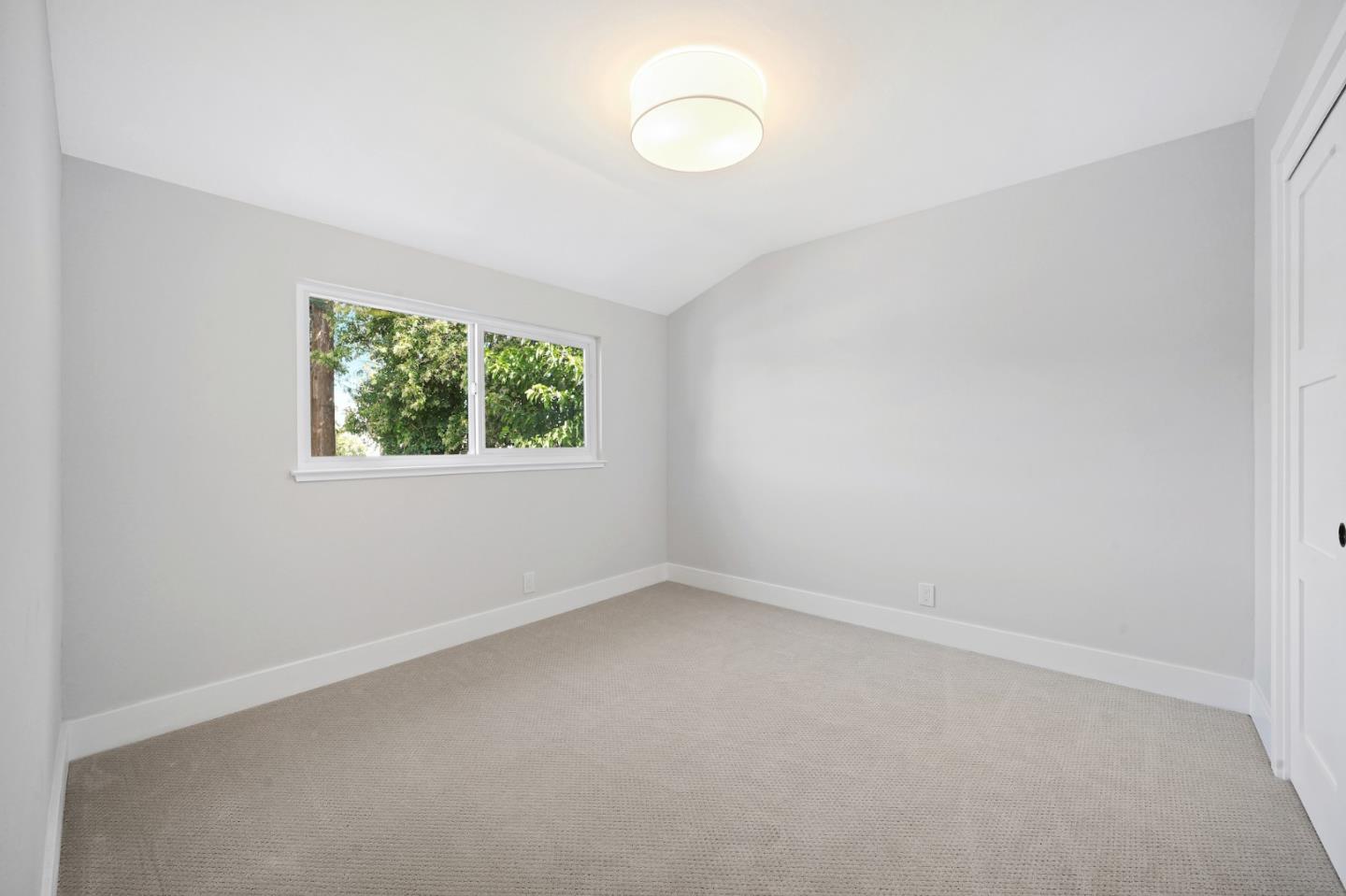 827 Bend Avenue San Jose, CA 95136 - Photo 21 of 27 an empty room with windows