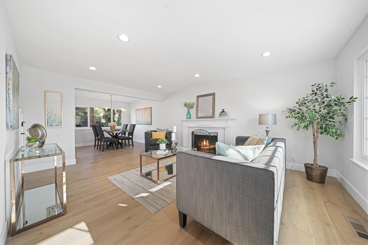827 Bend Avenue San Jose, CA 95136 - Photo 4 of 27 a living room with furniture a fireplace a potted plant and a table