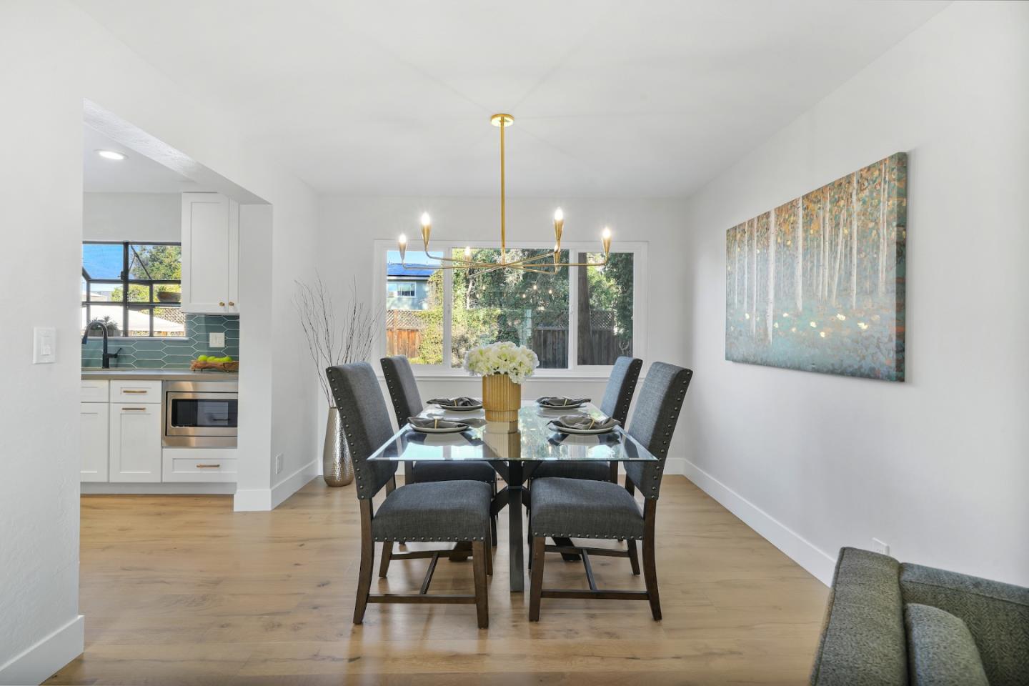 827 Bend Avenue San Jose, CA 95136 - Photo 6 of 27 a dining room with furniture a chandelier and wooden floor