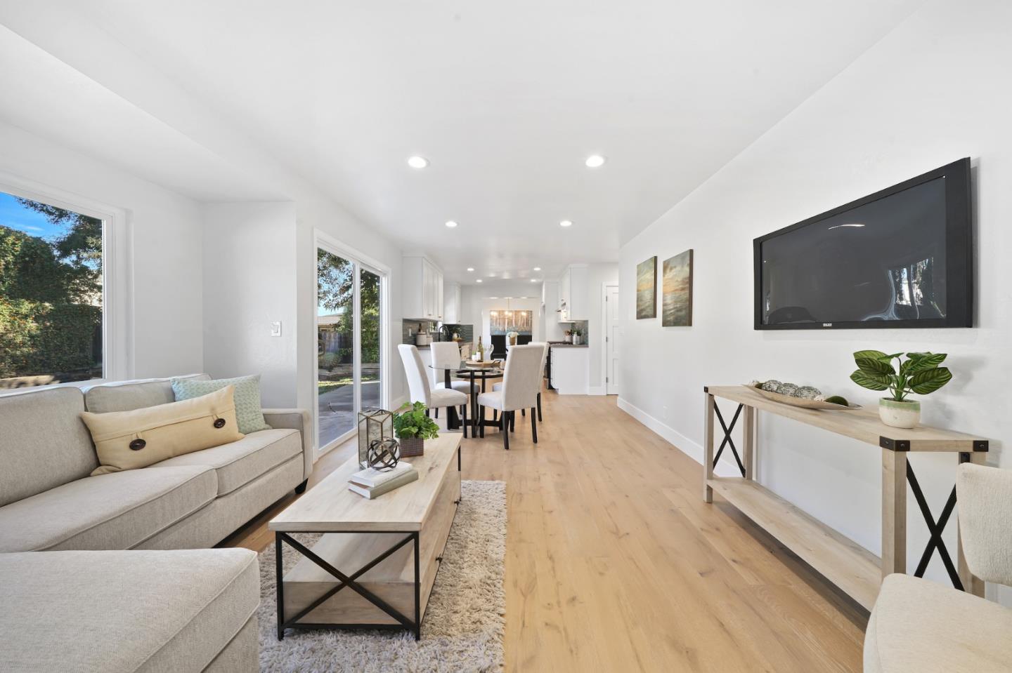 827 Bend Avenue San Jose, CA 95136 - Photo 10 of 27 a living room with furniture and a flat screen tv
