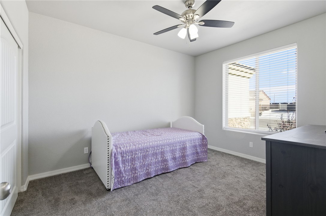 4713 North Old Ranch Lane Kingman, AZ 86401 - Photo 12 of 41 a spacious bedroom with a bed and a window