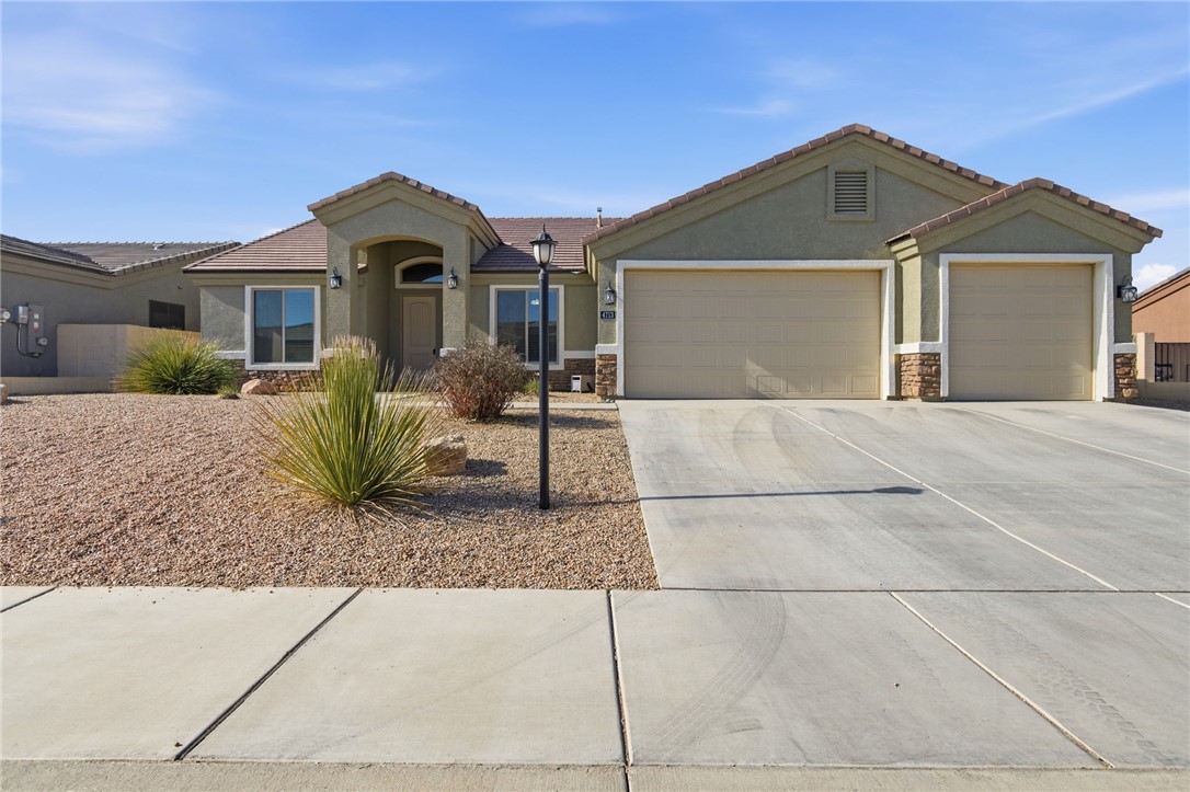 4713 North Old Ranch Lane Kingman, AZ 86401 - Photo 2 of 41 a front view of a house with a yard