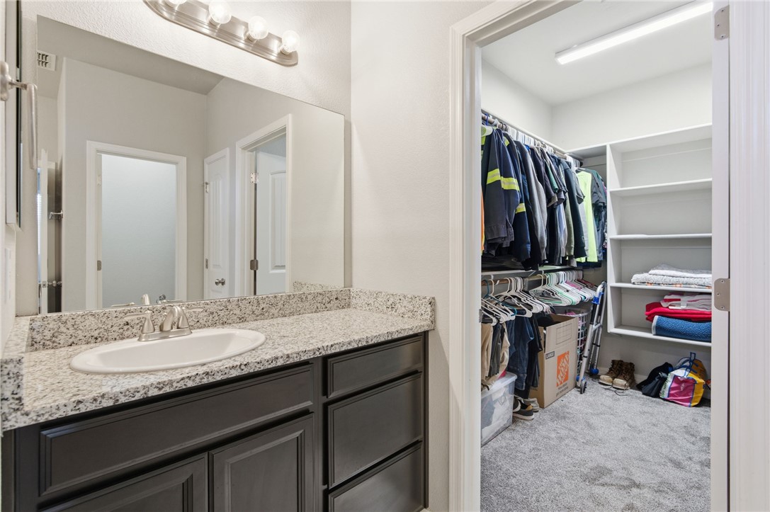 4713 North Old Ranch Lane Kingman, AZ 86401 - Photo 21 of 41 a bathroom with a sink double vanity and a mirror