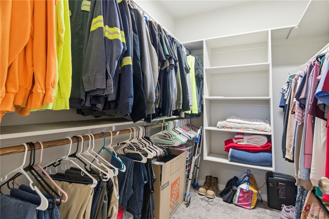 4713 North Old Ranch Lane Kingman, AZ 86401 - Photo 22 of 41 a view of walk in closet with clothes and shoes