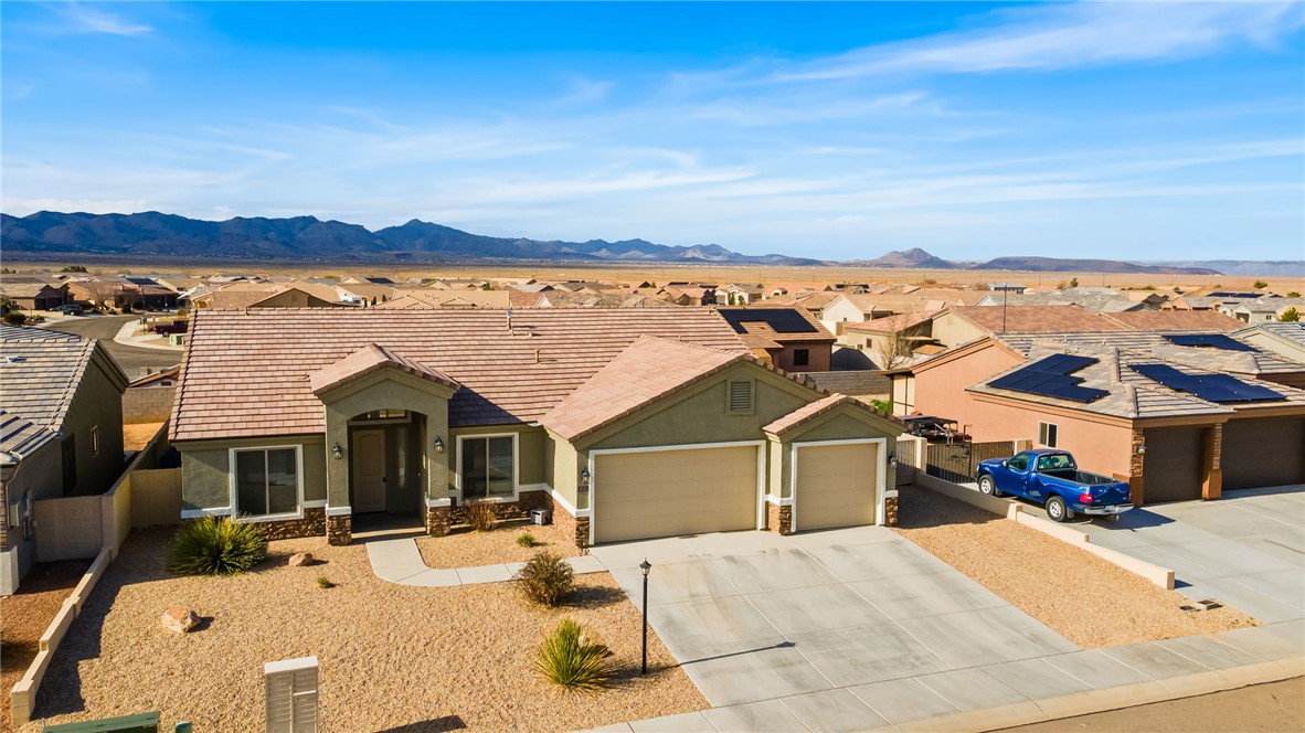 4713 North Old Ranch Lane Kingman, AZ 86401 - Photo 3 of 41 a view of a house with outdoor space and seating area
