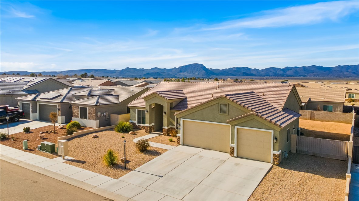 4713 North Old Ranch Lane Kingman, AZ 86401 - Photo 34 of 41 a view of a house with pool and chairs