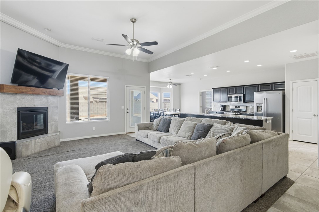 4713 North Old Ranch Lane Kingman, AZ 86401 - Photo 5 of 41 a living room with furniture and a fireplace