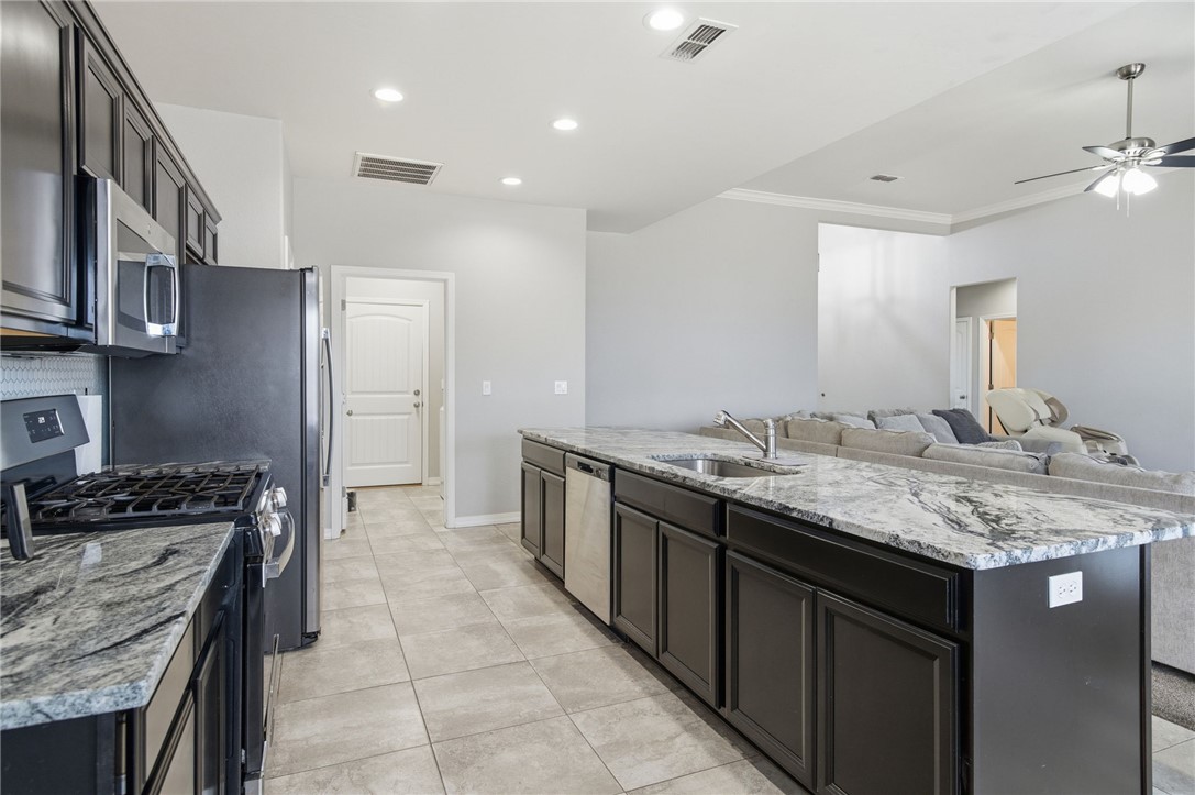 4713 North Old Ranch Lane Kingman, AZ 86401 - Photo 41 of 41 a kitchen with a sink stove and cabinets