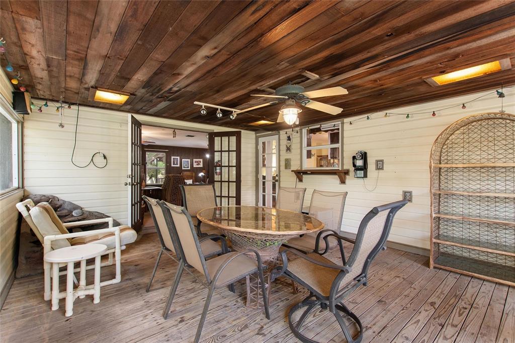 3641 Turtle Mound Road Melbourne, FL 32934 - Photo 18 of 77 a dining room with furniture and wooden floor