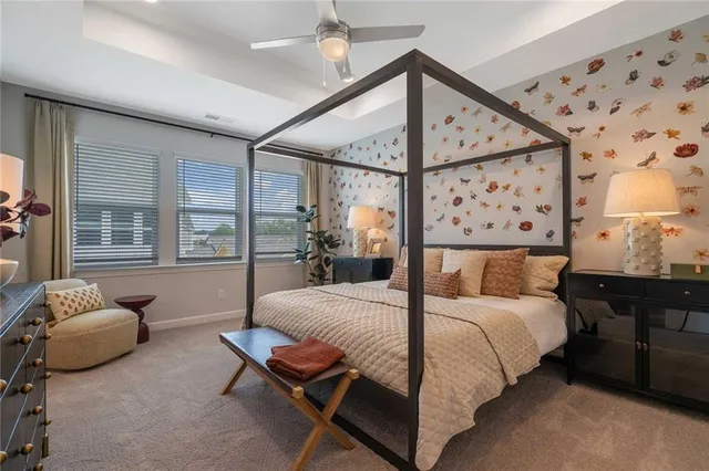 a white toilet sitting next to a shower