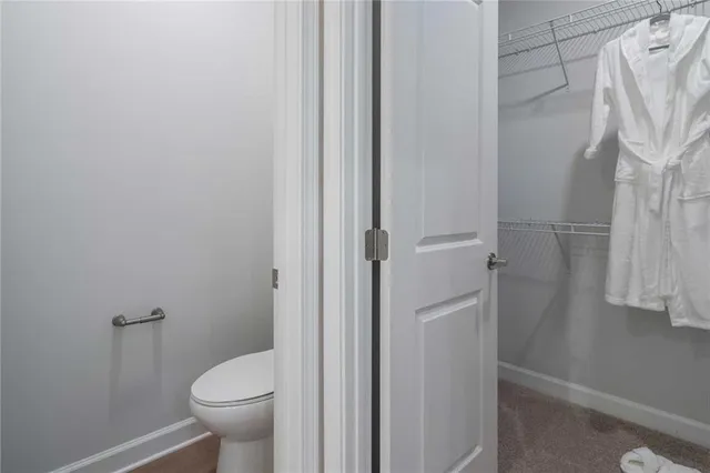 a bathroom with a shower and a glass door