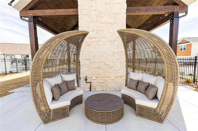 a outdoor living space with furniture and a floor to ceiling window