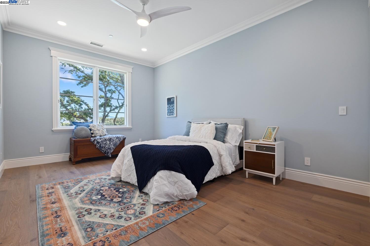 700 Clipper Hill Road Danville, CA 94526 - Photo 17 of 35 a spacious bedroom with a bed a couch and a window