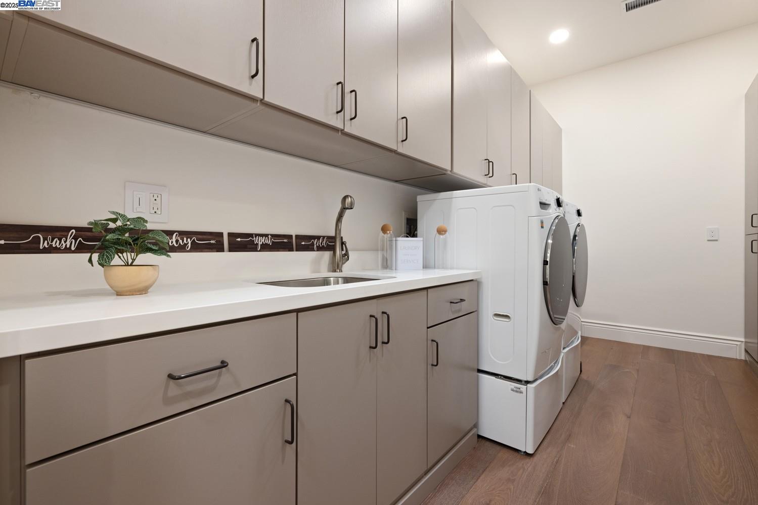 700 Clipper Hill Road Danville, CA 94526 - Photo 23 of 35 a kitchen with sink cabinets and wooden floor