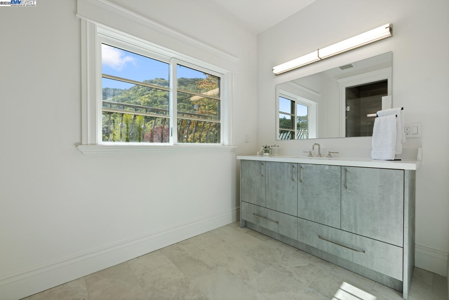 700 Clipper Hill Road Danville, CA 94526 - Photo 33 of 35 a bathroom with a sink and a mirror