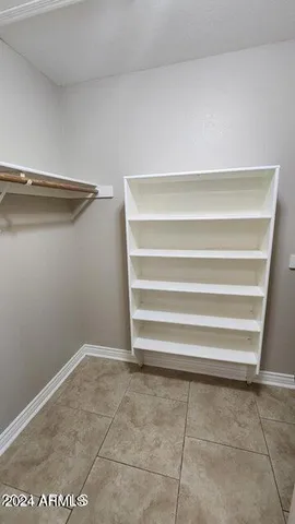 a bathroom with a sink a mirror and shower