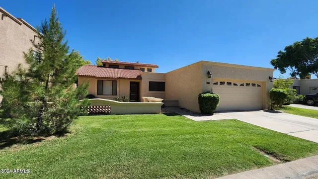 a view of a house with a yard