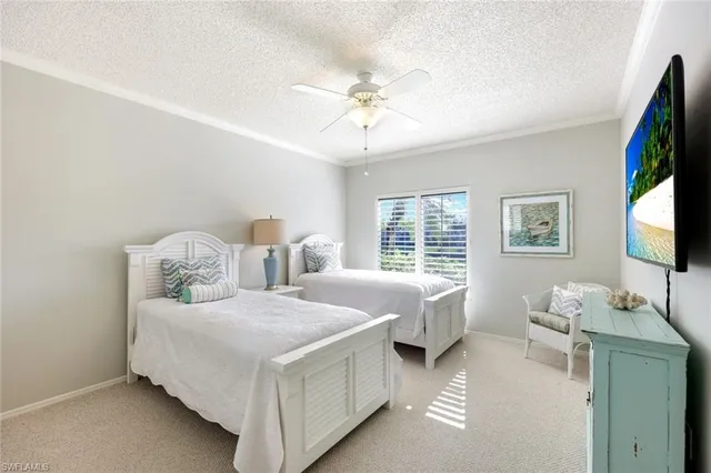 a bathroom with a bathtub a double vanity sink and a mirror