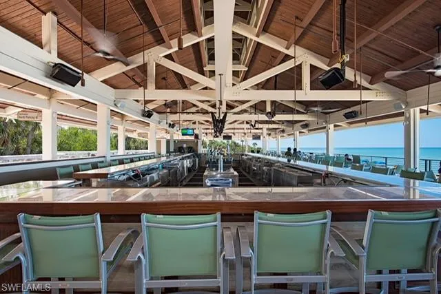 a room with lots of wooden furniture and a sink