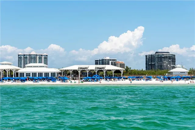 a view of a building with outdoor space and trees in the background