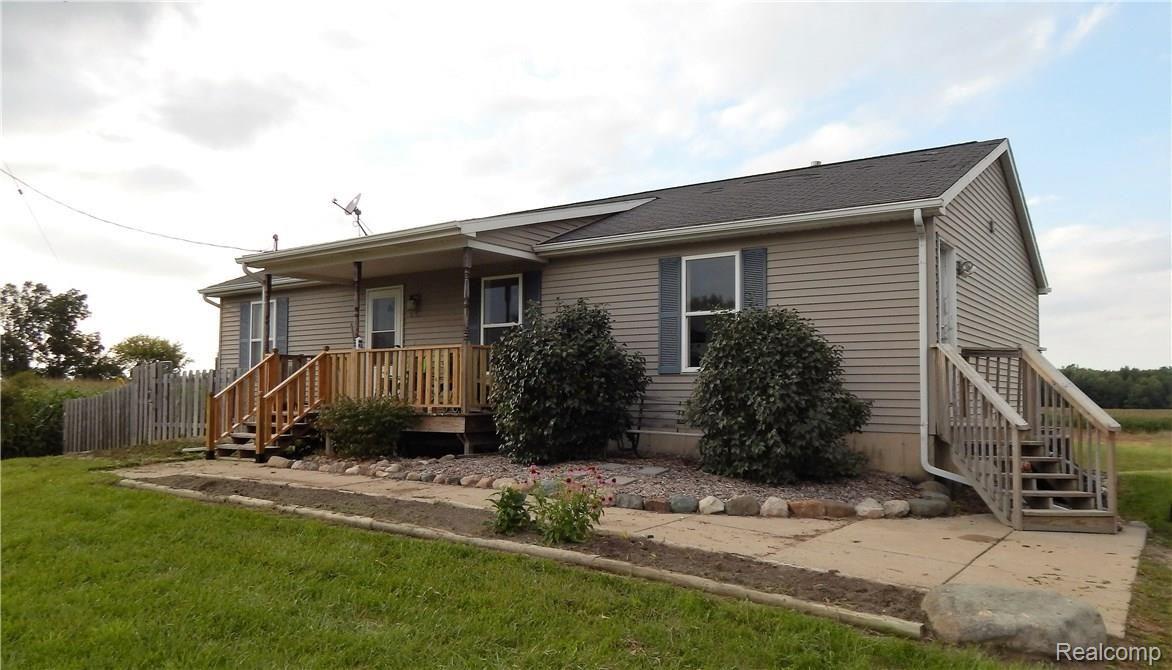 9792 Judd Road Fowlerville, MI 48836 - Photo 1 of 21 Front of home with porch and side entry