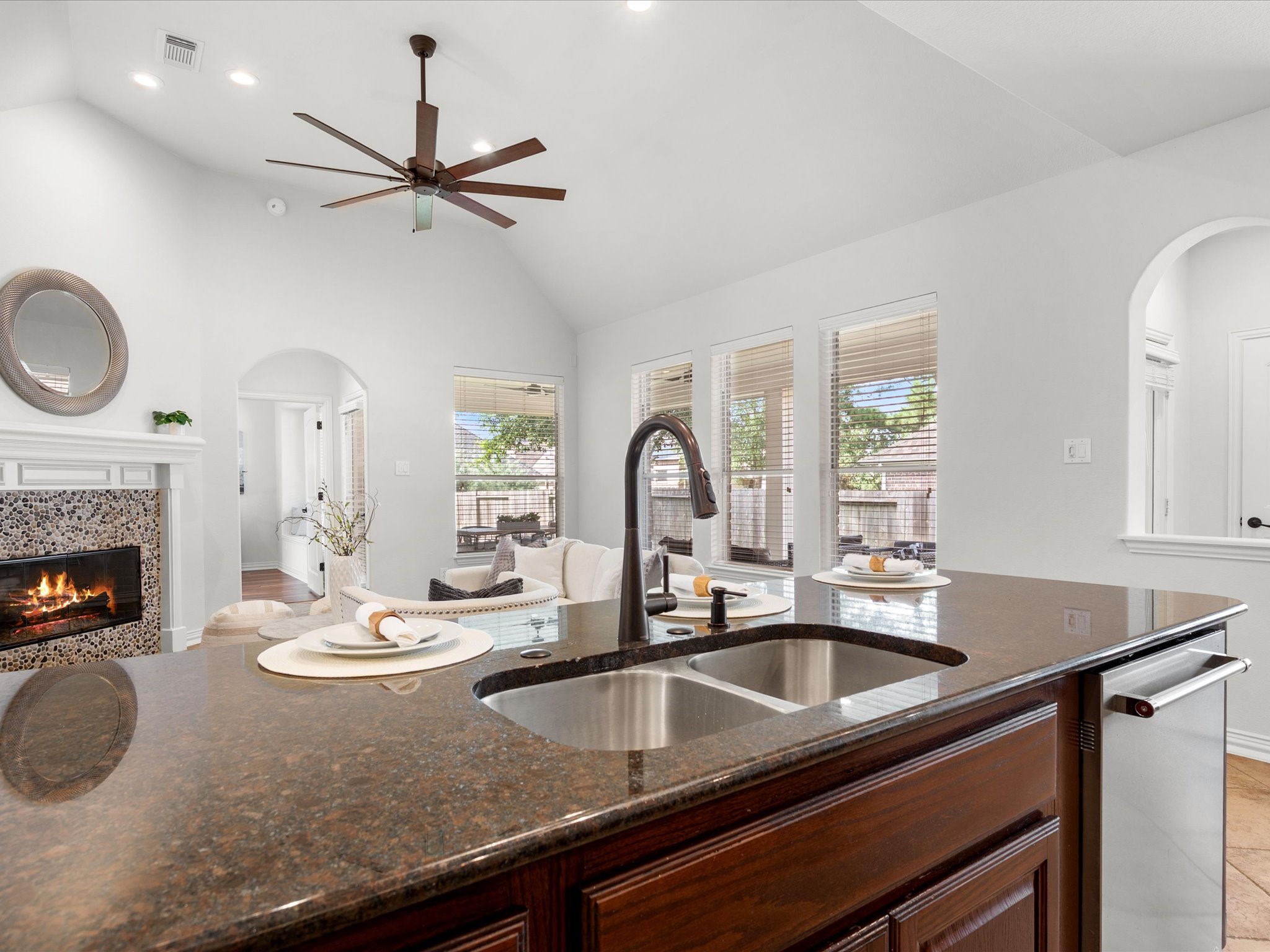 323 Arbor Ridge Lane Conroe, TX 77384 - Photo 10 of 40 Open concept done right. Cook, pour a glass of wine, and never miss a beat with everyone gathered by the fire. This is where your people will end up every time.