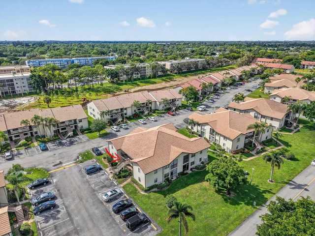 an aerial view of a house with a lake view