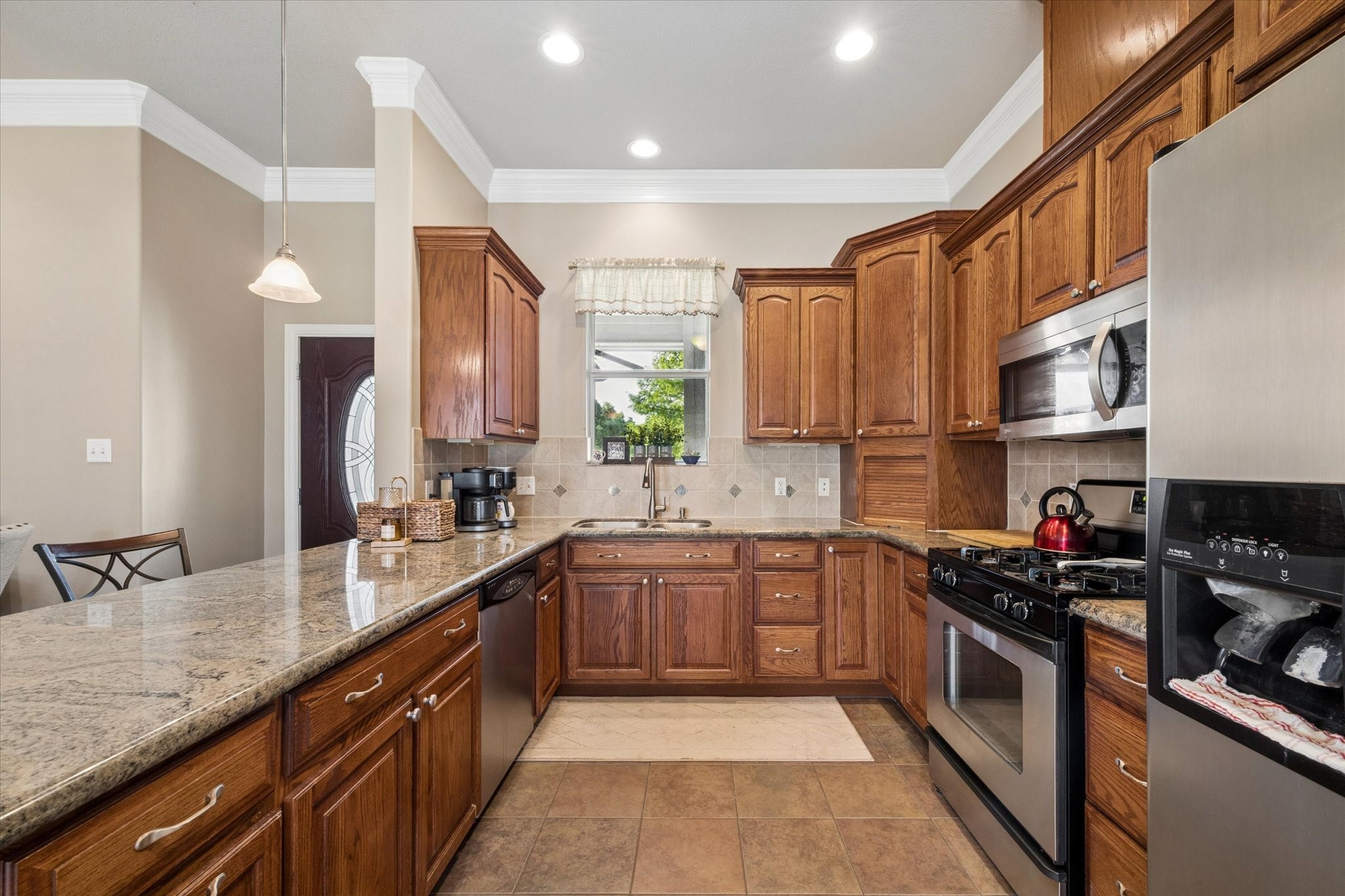 16519 Deerhaven Run Rosharon, TX 77583 - Photo 29 of 47 a open kitchen with stainless steel appliances granite countertop a sink and cabinets