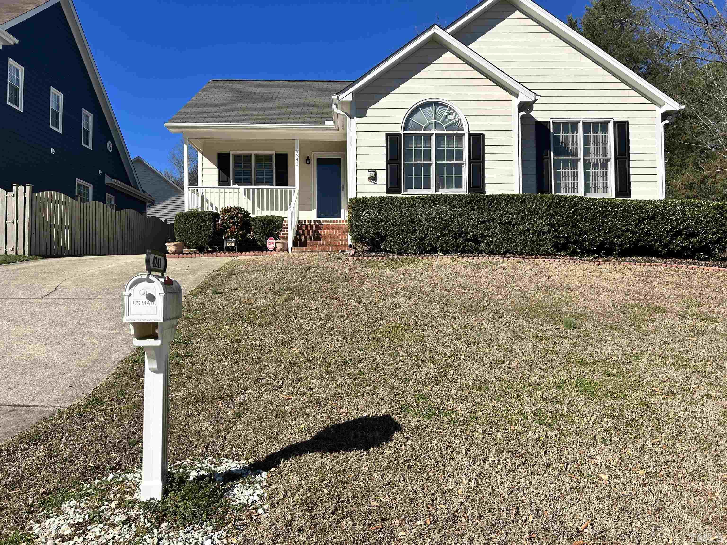 4241 Knightsbridge Way Raleigh, NC 27604 - Photo 1 of 19 a front view of a house with garden