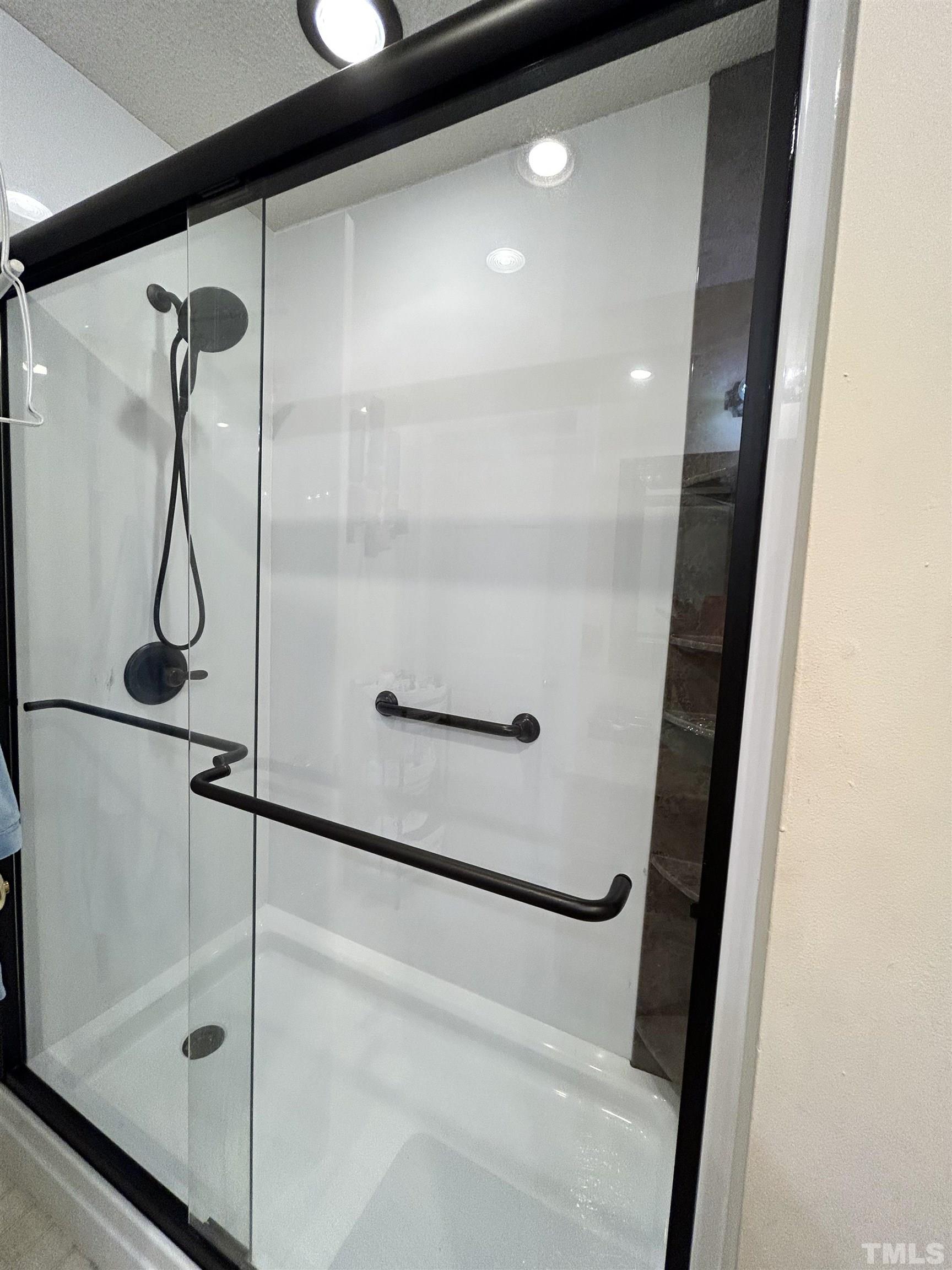 4241 Knightsbridge Way Raleigh, NC 27604 - Photo 14 of 19 a bathroom with a glass shower door