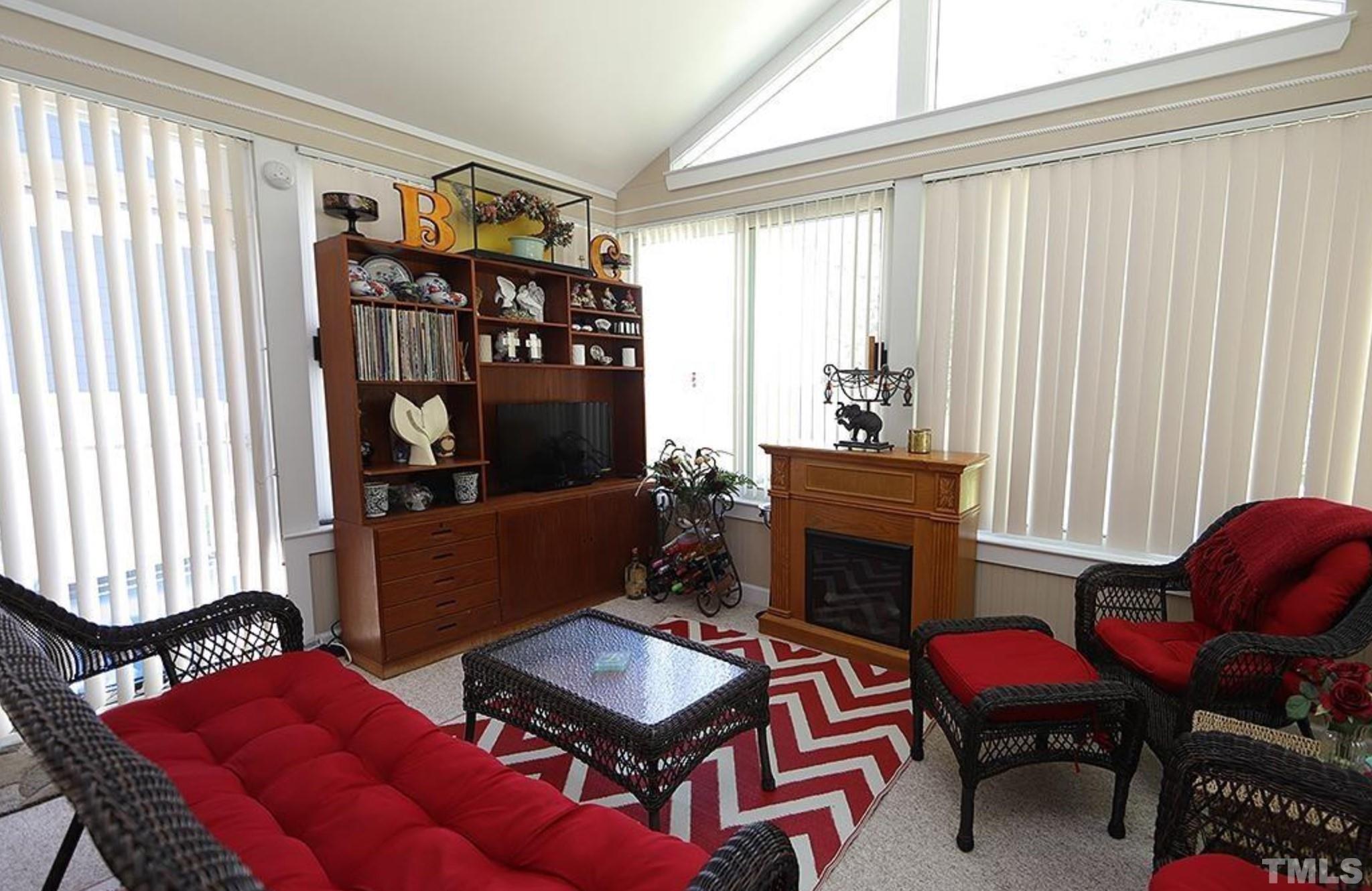4241 Knightsbridge Way Raleigh, NC 27604 - Photo 18 of 19 a living room with furniture and a fireplace