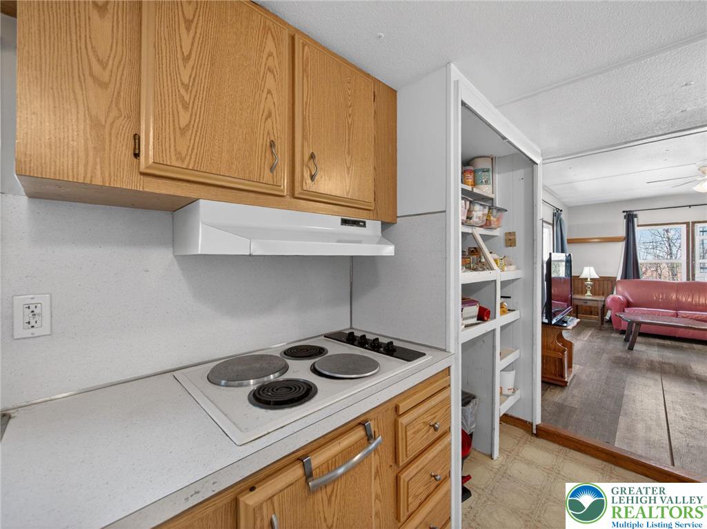 23 Roth Avenue Mertztown, PA 19539 - Photo 14 of 29 a kitchen with stainless steel appliances granite countertop a sink stove and cabinets