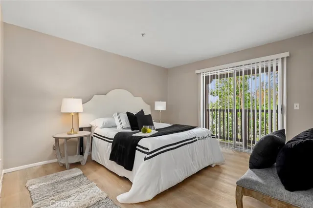 a bed room with a bed and a lamp