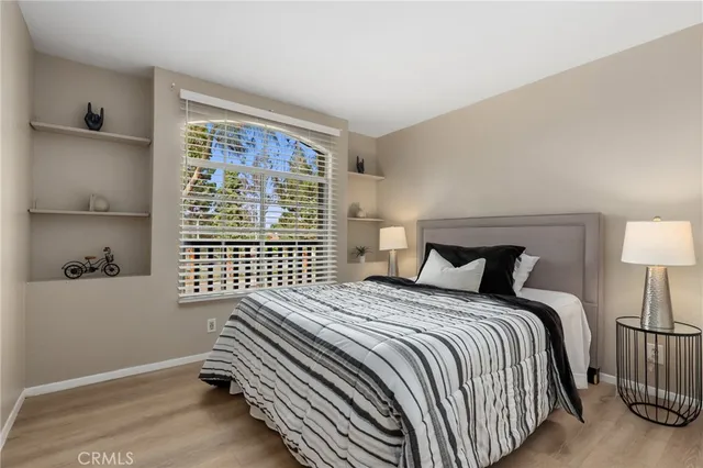 a bedroom with a bed and a window