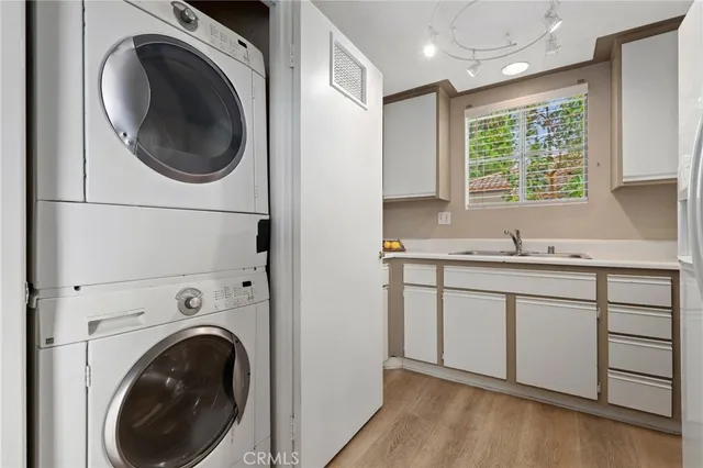 a view of a kitchen with washer and dryer
