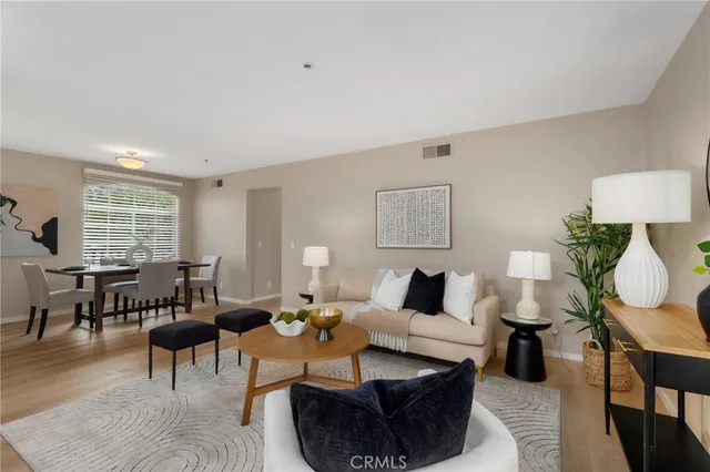 a living room with furniture and a lamp